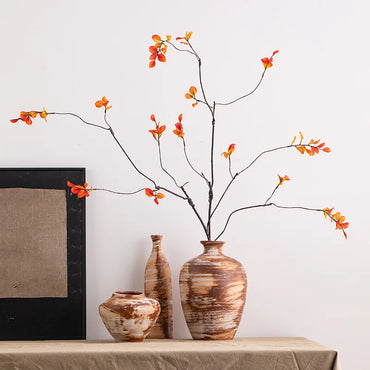 Ceravue ceramic and porcelain vases with rough clay pottery texture in various sizes, holding fresh and dried flowers