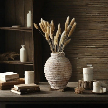 Amfora rustic ceramic vase with rough pottery texture, standing 13cm wide by 19cm high, holding dried flowers